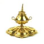 A Victorian brass Gothic style inkwell In the Eastern taste,