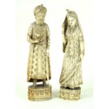 A pair of Indian carved ivory/bone figures Circa 1900, depicting Mohammed Shah, height 24cm,