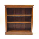 A Victorian oak open front bookcase Having a multi cornice above two open front adjustable shelves