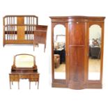 An Edwardian inlaid mahogany bedroom suite Comprising a three door wardrobe with central marquetry