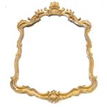 A 19th Century carved gilt gesso wall mirror The ornate roccoco form with scroll and foliate motifs