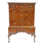 An early 18th Century walnut chest on stand The moulded cornice above three short and three long