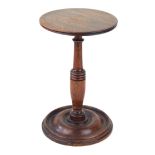 A Georgian mahogany candle stand Raised on a single knop stem, height 22.
