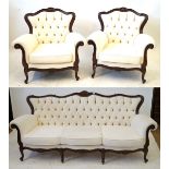 A reproduction French Art Nouveau style three piece suite upholstered in a cream button back