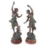 A pair of bronzed spelter figures 'Fleur De Mai' and 'Rosee Du Matin',