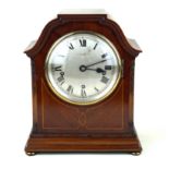 A late Victorian / Edwardian inlaid mahogany five chime bracket clock The silvered dial with Roman