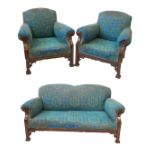 A Chippendale revival oak framed three piece settee suite,