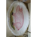 A vintage Italian pottery meat plate decorated with a pig.