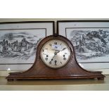 An early 20th Century oak mantel clock.