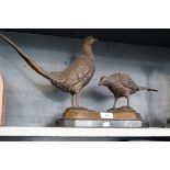 A good quality reproduction figure group depicting two pheasants.