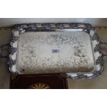 A good quality heavy gauge silver-plated twin handled tray having cast floral border.