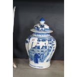 A Chinese blue and white jar and cover depicting figures, double ring mark to base.