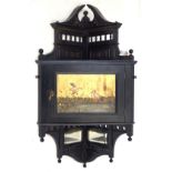 An Aesthetic Movement hanging corner cupboard Ebonised with gilt highlights,