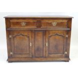 A period style solid oak side cabinet in the manner of Titchmarsh & Goodwin,