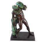 A good quality reproduction patinated bronze figure Modelled in the form a nude male water carrier,