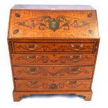 A fine quality 19th Century painted satinwood bureau The sloping hinged fall front enclosing a