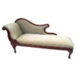 A Victorian mahogany show wood framed chaise-longue The ornate scrolling form reupholstered in a