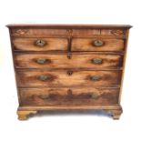 A George III inlaid mahogany chest of drawers The rectangular top with moulded edges above a