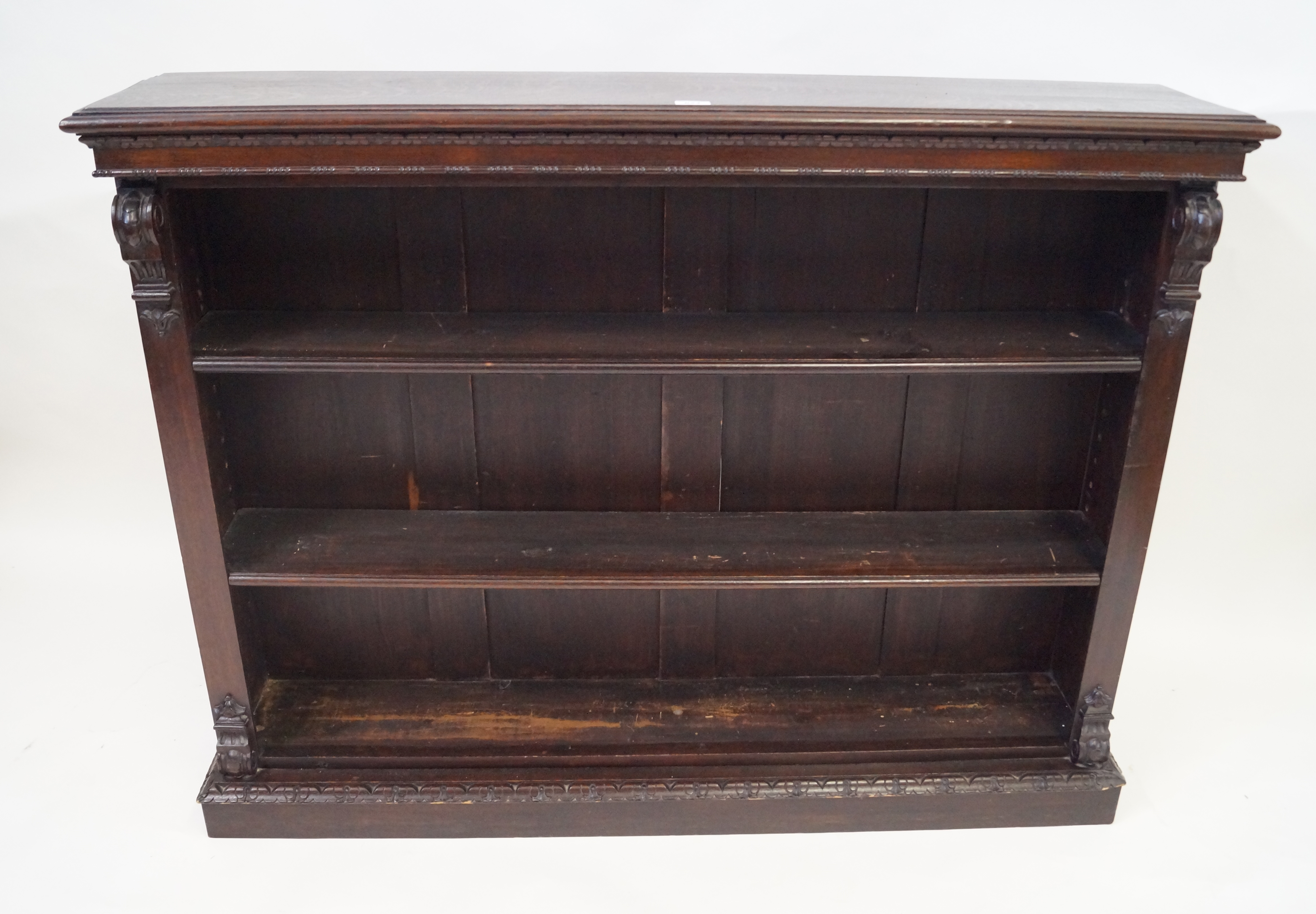 A Victorian oak open fronted low bookcase The moulded and beaded top above two adjustable shelves,