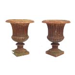 A pair of Period-style cast iron garden urns Each being of classical revival form with flared