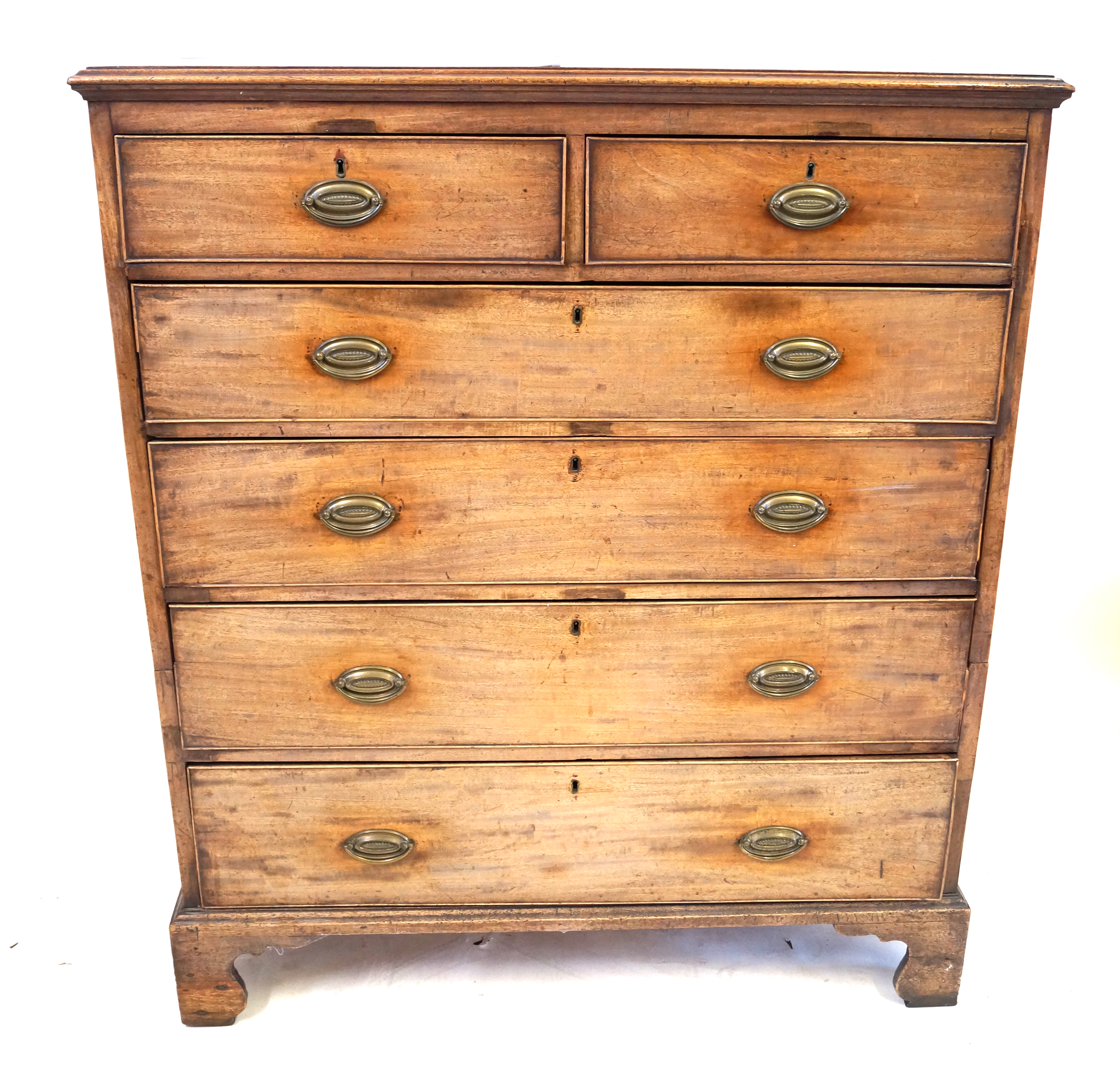 A George III mahogany straight front bedroom chest The moulded top above two short and four long