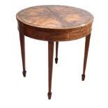 A fine quality 19th Century inlaid and crossbanded circular library table The radially veneered