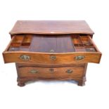 A fine quality early George III mahogany serpentine fronted dressing chest Featuring a fitted top