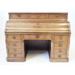 A good quality Victorian mahogany pedestal desk The raised super-structure incorporating three