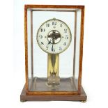 A Bulle patent electric four glass mantle clock The 14cm dial enclosing a skeletonised centre,