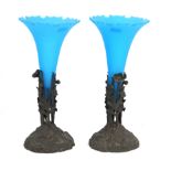 A pair of Victorian posy vases Each raised on bronzed spelter bases with cast floral decoration,