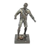 A cold painted spelter figure Depicting a footballer, raised on a plinth base,