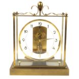 A Junghans ATO Anticlimactic Electric mantle clock Having brass framed case,