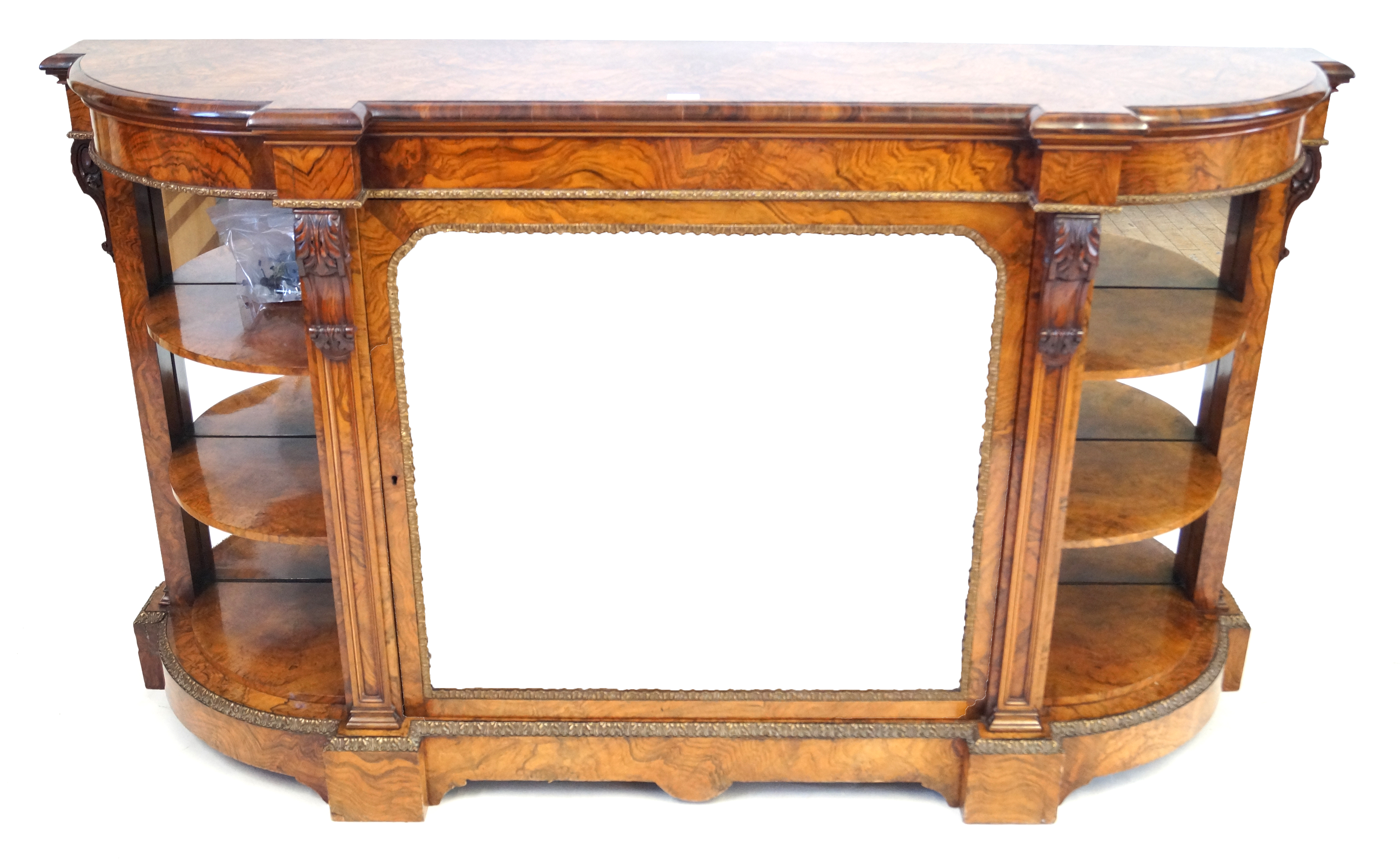 A fine quality Victorian gilt metal mounted figured walnut credenza The highly decorative shaped