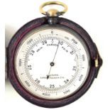 A brass cased pocket pocket barometer The silvered dial marked J.