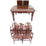 A late Victorian mahogany wind action extending dining table with two extra leaves and winder The