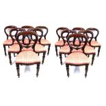 A set of twelve Victorian style mahogany balloon back dining chairs,