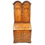 A fine George I walnut bureau bookcase The double domed top with two panelled,