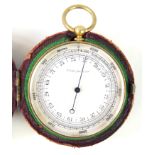 A brass cased pocket barometer The silver dial marked compense,