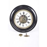 A French circular wall clock, late 19th early 20th Century Having a circular ebonised frame,