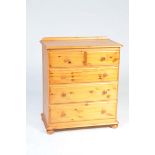 A modern pine chest of drawers With a rectangular moulded top above two short and three long