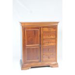 A reproduction mahogany Georgian style gents wardrobe by Willis & Gambier The rectangular top with