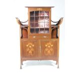 An exceptional early 20th Century Arts and Crafts mahogany display cabinet by Shapland &