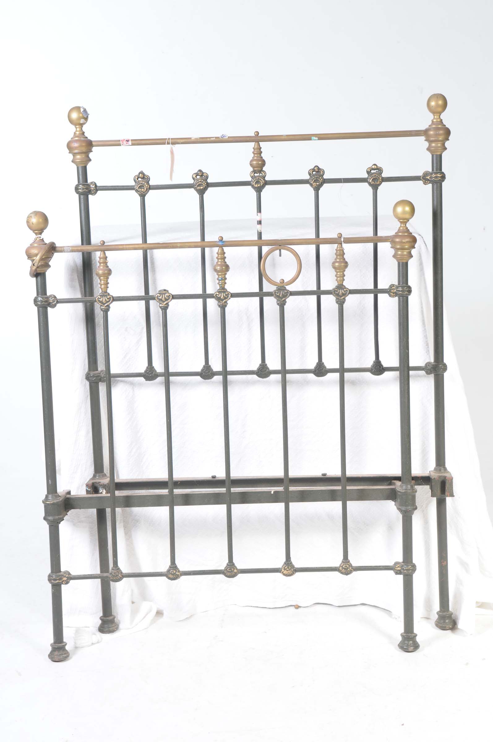 A Victorian painted iron and brass single bed,