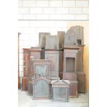 A collection of 18th and 19th Century grandfather clock cases and hoods To include seven clock