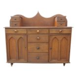 An unusual scumbled pine kitchen dresser The top with a shaped raised back and a pair of two drawer