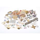 A collection of costume jewellery To include, beads, brooches and rings,