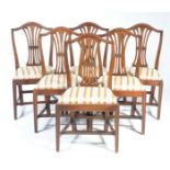 A set of six early 19th Century mahogany Hepplewhite style dining chairs Each with a pierced splat