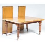 A 19th Century mahogany extending dining table The rectangular moulded top with rounded corners