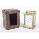 A brass framed carriage clock, late 19th early 20th Century Brass case with bevelled glass panels,