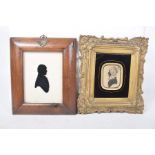 A 19th Century silhouette of a lady and a silhouette of a gentleman on glass The silhouette of the